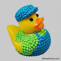 Decorative rubber duck with blue and green beaded accessories on a light gray background