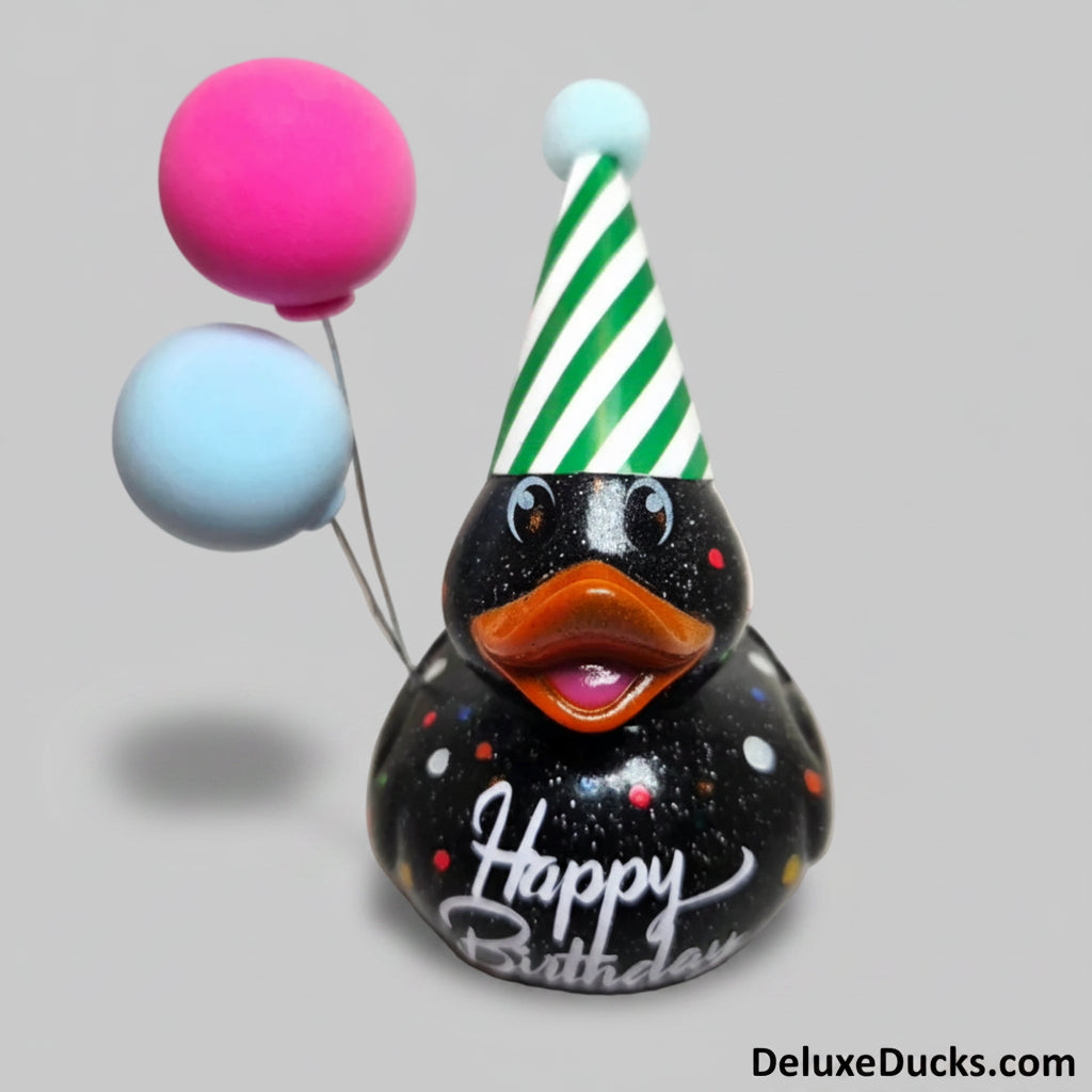 Decorative duck with a birthday hat and balloons on a light background