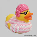 Decorative rubber duck with pink beaded head and body on a light gray background