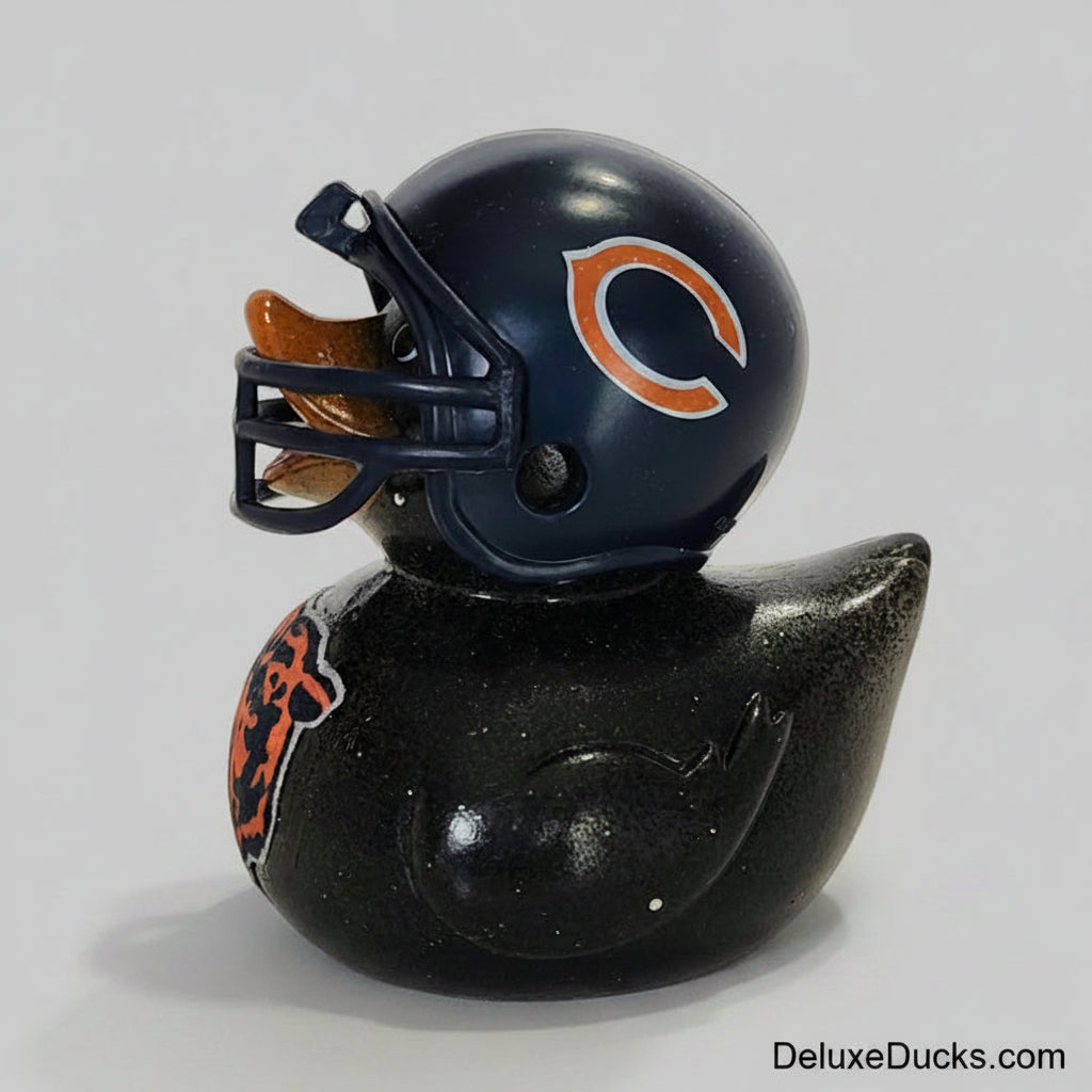 Black rubber duck with a Chicago Bears helmet on a white background