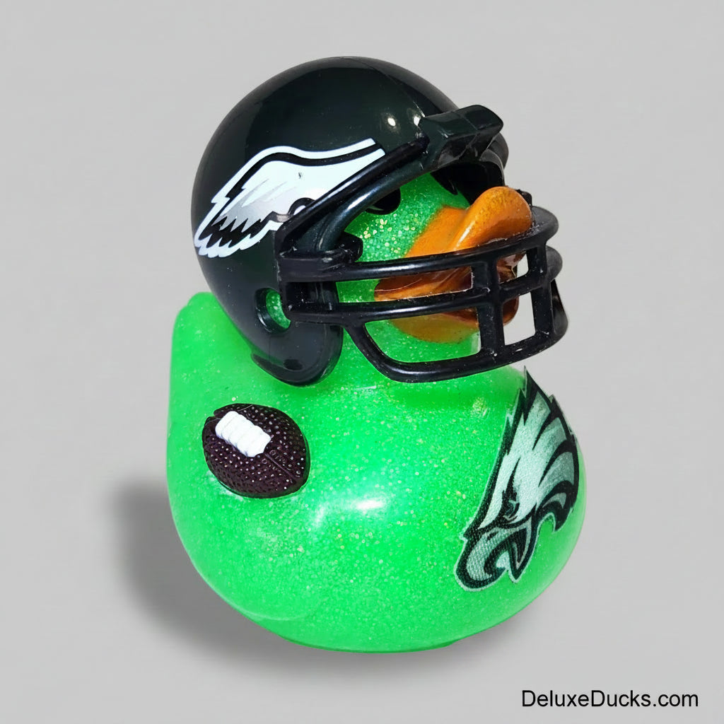 Green rubber duck with a football helmet and football on a white background