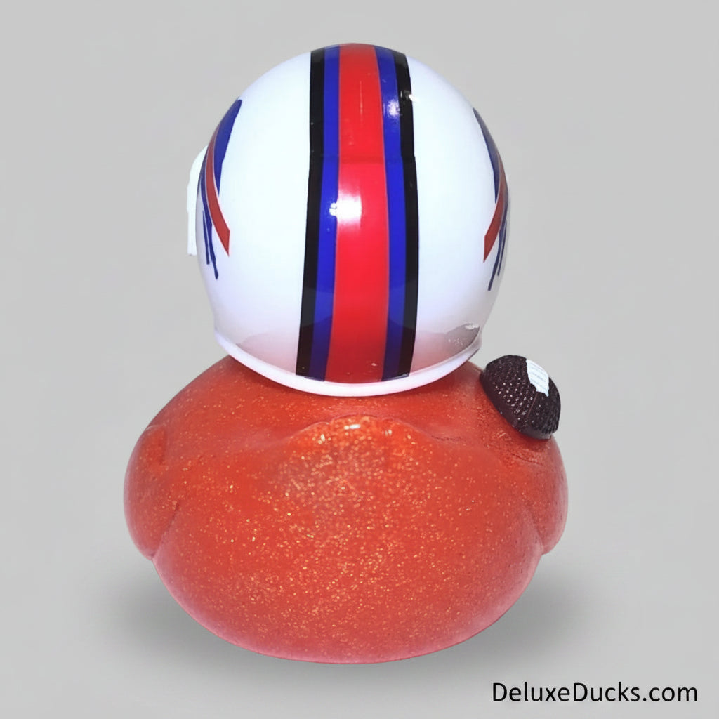 Rubber duck with a helmet and red body on a white background