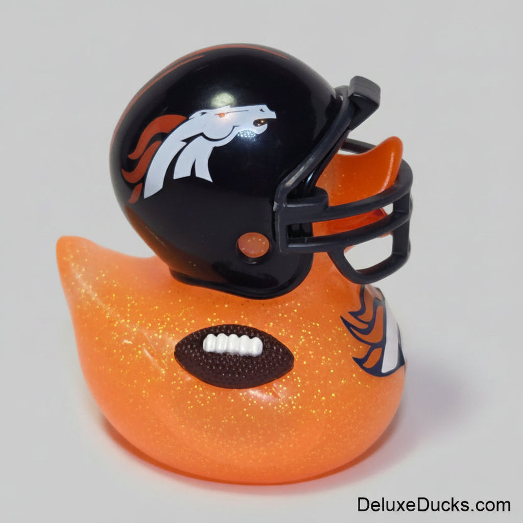 An orange glittery rubber duck styled like a football player, wearing a black helmet with a white and orange horse logo and holding a brown football.