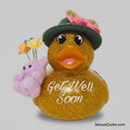Decorative duck with 'Get Well Soon' message, flowers, and teddy bear on a gray background
