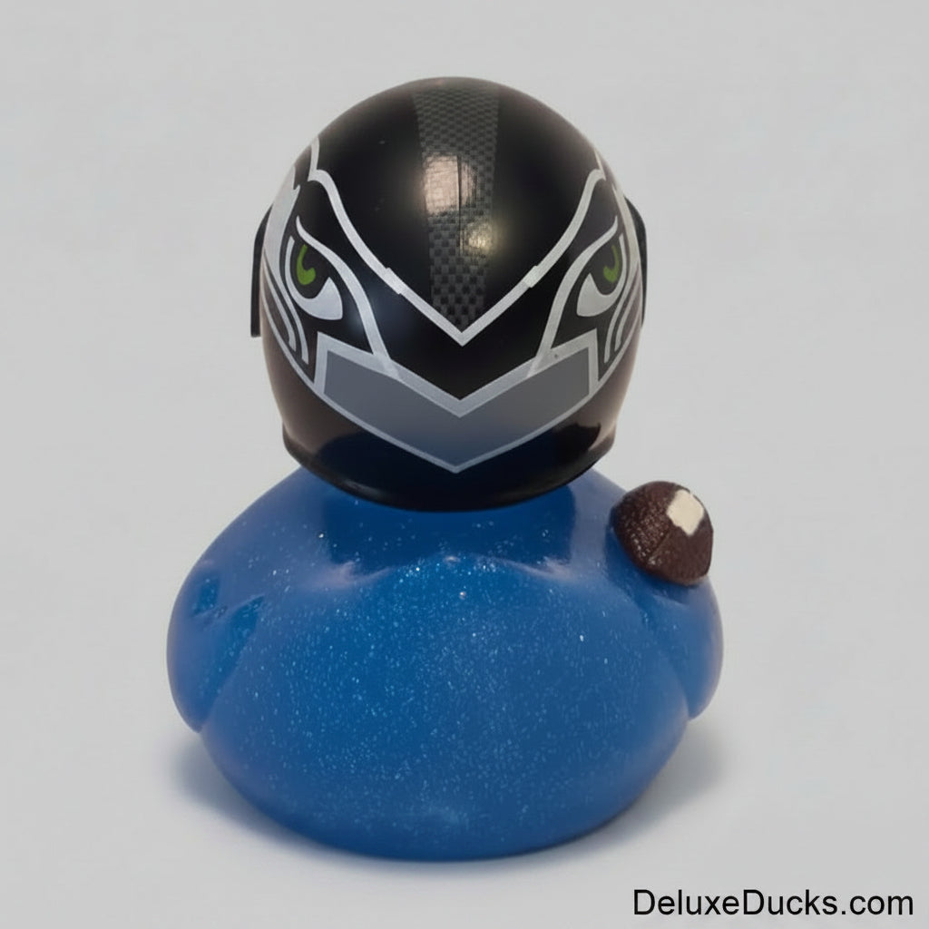 Blue rubber duck with a black and white helmet on a light background
