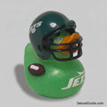 A green glittery rubber duck styled as a New York Jets duck, featuring a dark green football helmet with white and silver team logo details, a black faceguard, and an orange beak, sitting on a light beige background.