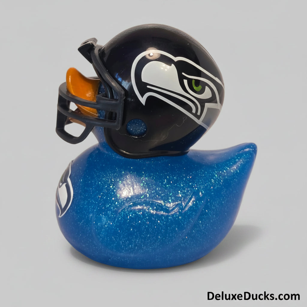Blue glittery duck-shaped toy with a football helmet on a gray background