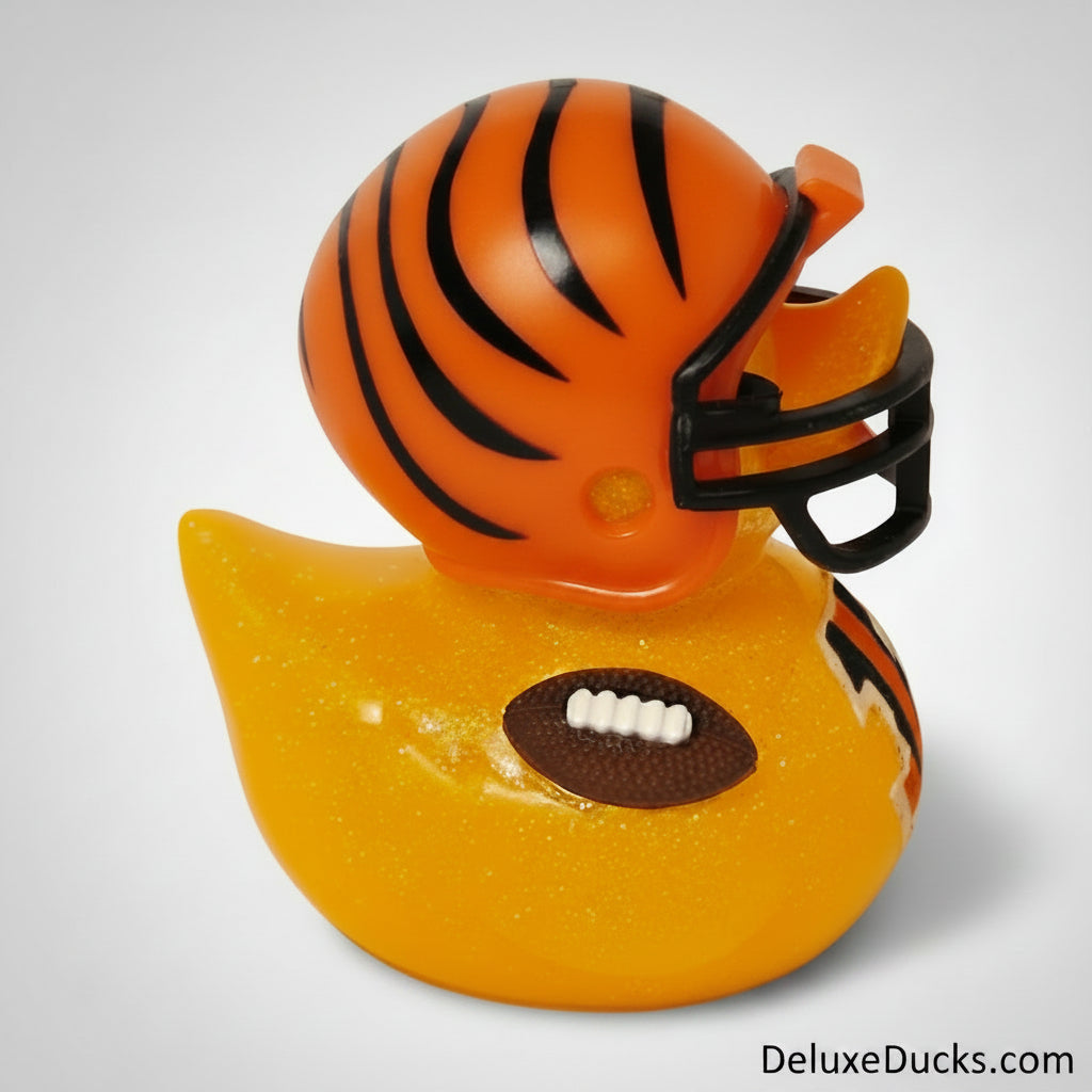 Rubber duck with an orange helmet and football design on a gray background