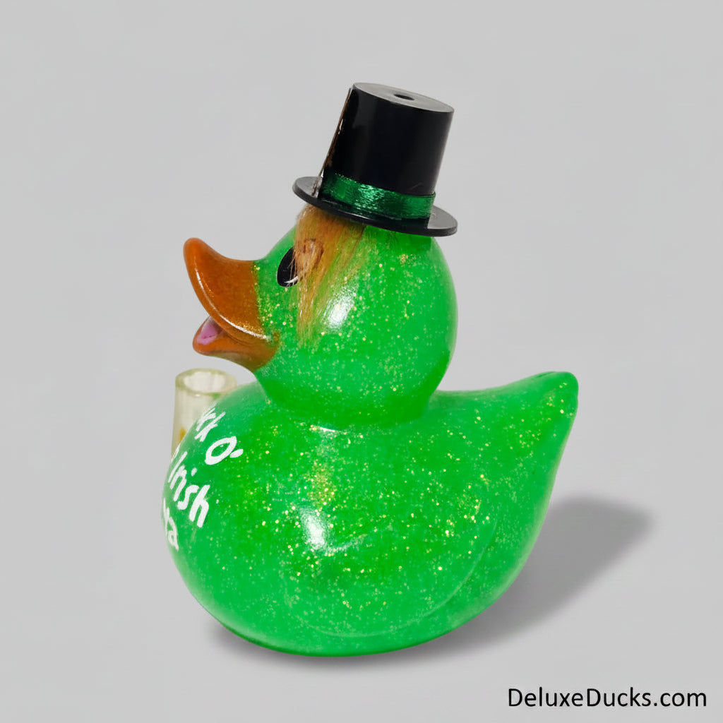 Green glittery rubber duck with a black top hat on a white background